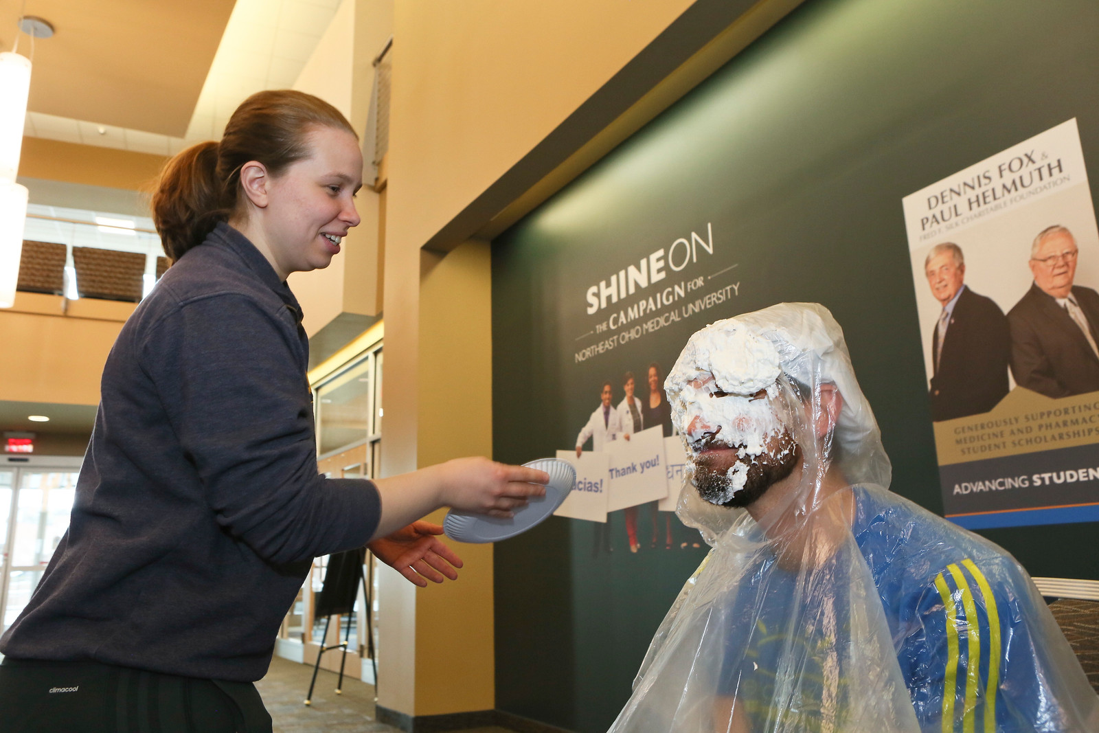Professor Jesse Young being pied by a student