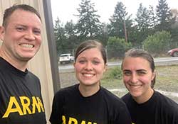 Three people in Army T-shirts.