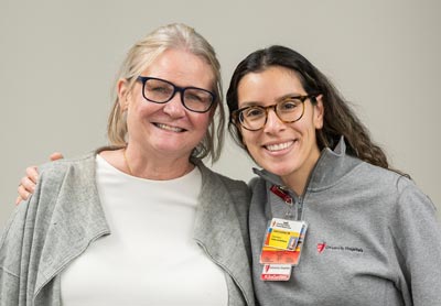 Two women standing side by side.