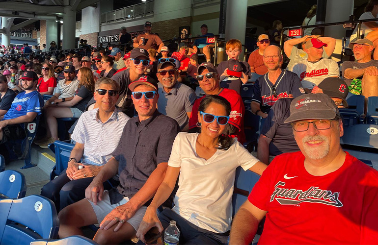 group of people in the stands at a baseball game
