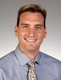 man wearing a blue shirt and tie