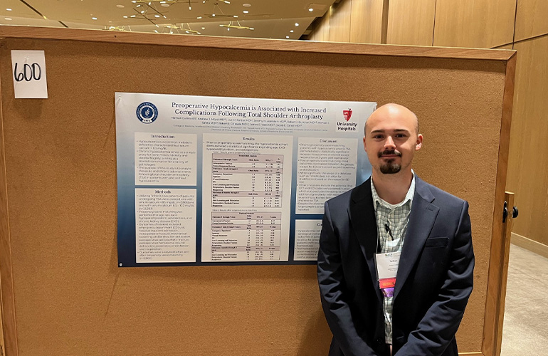Nathan Cuttic with his poster