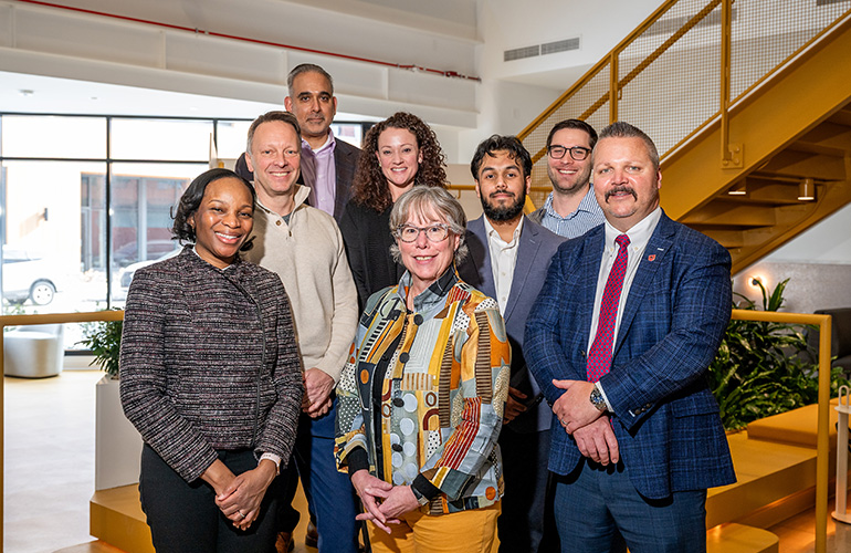 People smiling and standing