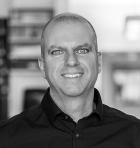 Black and white headshot of Achim Klug