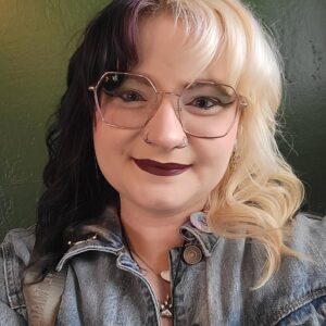 Snapshot of young woman with two-toned hair and glasses