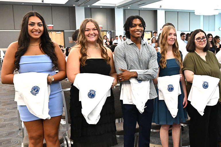 NEOMED College of Pharmacy students smiling at the 2026 Pharmacy White Coat Ceremony