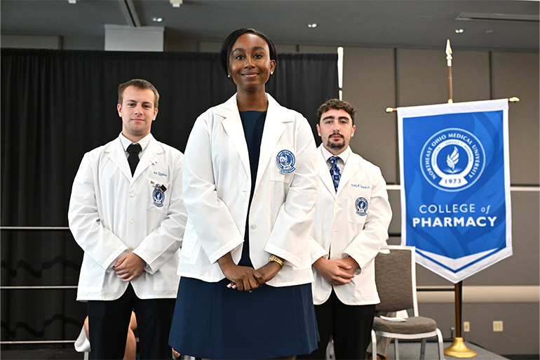 NEOMED College of Pharmacy student smiling at the 2026 Pharmacy White Coat Ceremony
